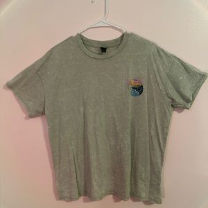 Sage green shirt with picture of sunset on the front and back. Size medium.